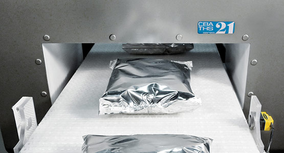 Industrial metal detection for products in foil or aluminum packaging