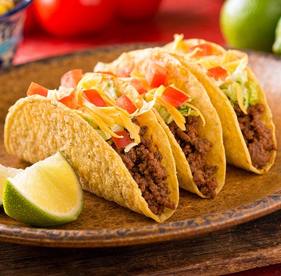 Continuous fryer system for formed taco shells