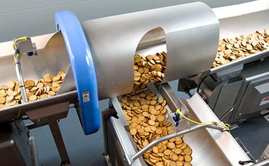Conveying crackers to packaging equipment