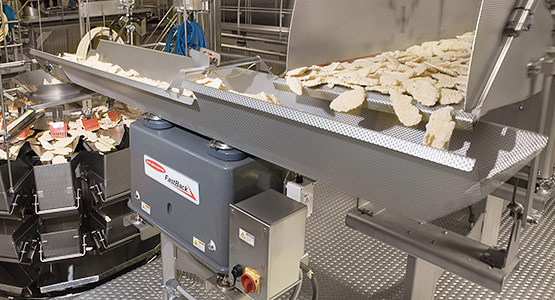 Conveying frozen poultry to weighers