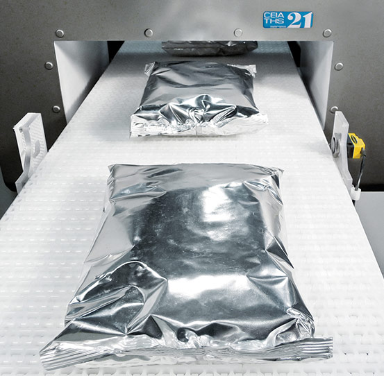 Industrial metal detection for products in foil or aluminum packaging
