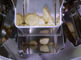 Automated weighing of snack foods and potato chips