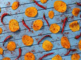 Sistemas de aplicación de sazonado en snacks