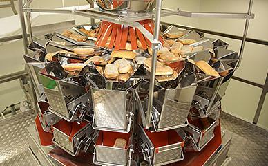 Weighing of baked bread products