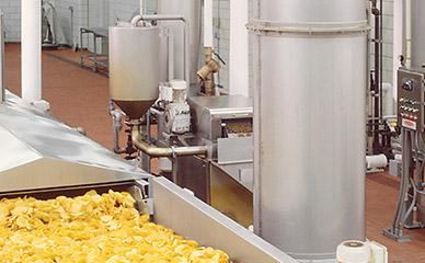 Oil filtration for corn and tortilla chip frying systems