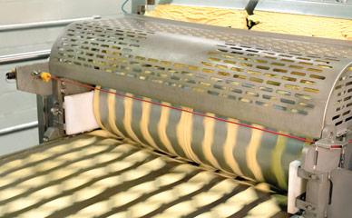 Sheeting corn masa before frying