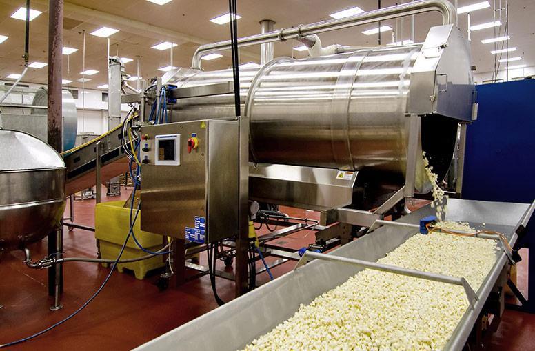 Applying liquid coating and dry seasoning to popcorn